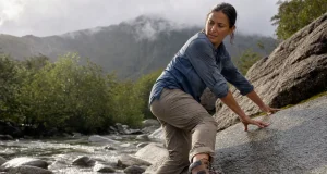 Which Outsole Rubber Grips Wet Rock? Not the Logo Hiker testing outsole rubber grip on wet rock with a Vibram Megagrip hiking boot after rain
