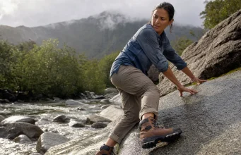 Which Outsole Rubber Grips Wet Rock? Not the Logo Hiker testing outsole rubber grip on wet rock with a Vibram Megagrip hiking boot after rain