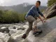 Which Outsole Rubber Grips Wet Rock? Not the Logo Hiker testing outsole rubber grip on wet rock with a Vibram Megagrip hiking boot after rain