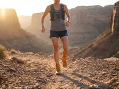 Ankle Gaiters Ranked After 500 Miles on the Trail Trail runner wearing Kahtoola ankle gaiters on rocky desert singletrack — best ankle gaiters for trail running