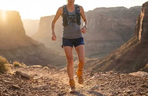 Ankle Gaiters Ranked After 500 Miles on the Trail Trail runner wearing Kahtoola ankle gaiters on rocky desert singletrack — best ankle gaiters for trail running