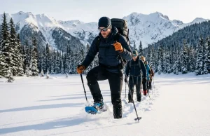 Breaking Trail in Snowshoes Burns Twice the Calories Hiker breaking trail in deep powder on Tubbs snowshoes, high knee lift, sub-alpine snowfield