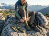 I Tested Every Sock Height on 5 Different Trails Hiker comparing crew ankle and knee-high sock heights on alpine trail with hiking boots