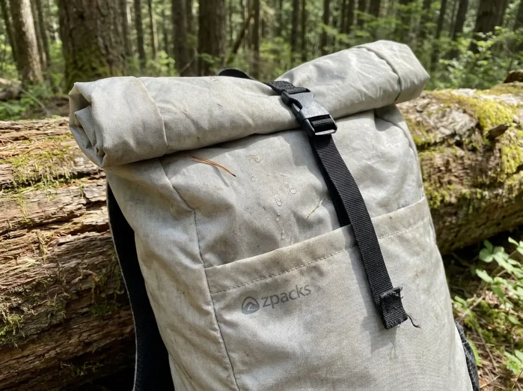Close-up of a roll-top backpack closure folded and buckled on a Zpacks Arc Haul pack