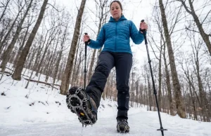 Yaktrax vs Kahtoola — One Fails on Real Ice Woman descending icy winter switchback with Kahtoola MICROspikes on Oboz boots — traction device comparison