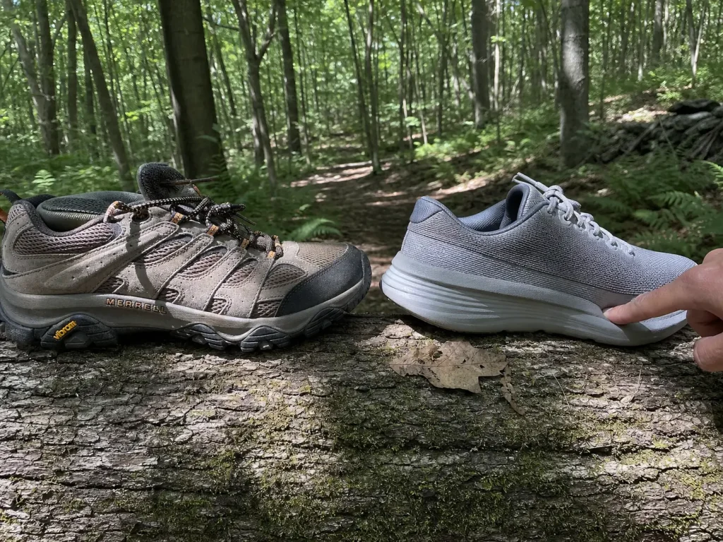 A firm low-cut hiking shoe beside a soft cushioned trainer, the support choice for flat feet