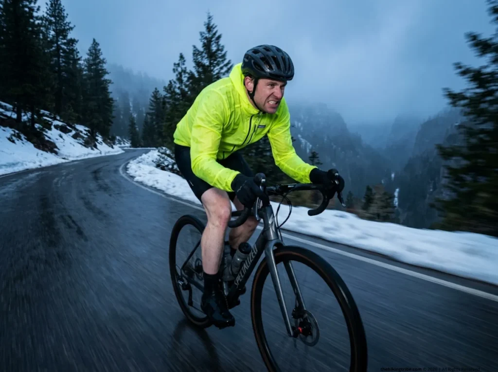 Freezing bikepacker rapidly descending slick road.