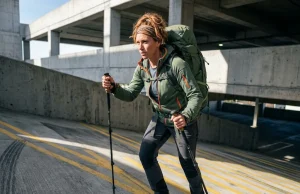 How to Train for Your First Thru Hike (Flatland Plan) Female hiker training with loaded Osprey backpack on urban parking garage ramp