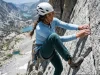 Hiking Pants Stretch Test (Sit, Squat & Climb Method) Female climber high-stepping to test stretch of Arc'teryx hiking pants