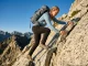 Hiking Shoes for Flat Feet Skip the Soft Ones Female hiker wearing La Sportiva Spire GTX hiking shoes for flat feet arch support options on a rocky ridge.