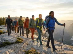 After Leading 50+ Group Hikes, This is What Actually Works Diverse hiking group moving along a mountain ridgeline led by an experienced hike leader
