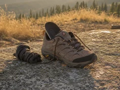 Gore-Tex vs Mesh Hiking Shoes The Breathability Cost Mesh hiking shoe drying on a rock at dusk, illustrating the Gore-Tex breathability trade-off