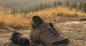 Gore-Tex vs Mesh Hiking Shoes The Breathability Cost Mesh hiking shoe drying on a rock at dusk, illustrating the Gore-Tex breathability trade-off