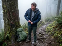 Why Most Hikers Ditch 3 in 1 Jackets After One Season Hiker on a misty trail removing a bulky 3-in-1 jacket mid-hike
