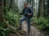 Why Your Gore-Tex Shoes Still Feel Wet Inside Hiker looking at saturated Gore Tex hiking boots in rain