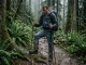Why Your Gore-Tex Shoes Still Feel Wet Inside Hiker looking at saturated Gore Tex hiking boots in rain
