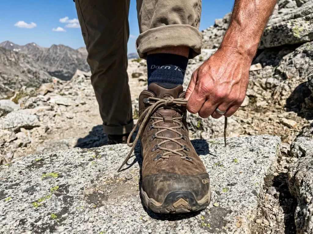 Using the surgeon's knot lacing technique to lock the heel in an Oboz boot.