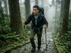 Can You Hike Kumano Kodo Without a Guide? Here’s the Truth Backpacker climbing steep mossy stone steps hiking in japan kumano kodo guide