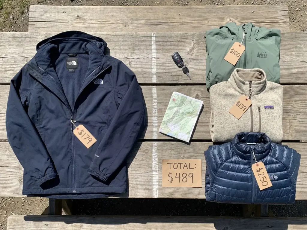 Hiking gear budget comparison with jacket components and price tags visible