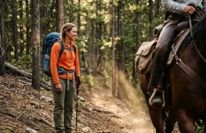 Hiking Trail Etiquette and the Physics Behind It Hiker demonstrating trail etiquette by safely stepping to the downhill side to yield to a passing pack horse on a forest trail.