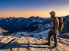 Best Polarized Hiking Sunglasses — UV400 Rated Hiker on alpine ridge wearing polarized hiking sunglasses with UV400 protection at high altitude.