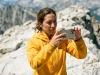 Smartphone Photography Tips for Day Hikers Field-Tested Female hiker using a smartphone for trail photography