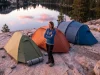 Tent Weight Buying Guide What the Specs Hide Backpacking tents of different sizes set up at a mountain campsite at dawn