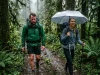 Trekking Umbrella vs Rain Jacket I Tested Both Side-by-side comparison of hiker in a sweaty rain jacket versus a hiker under a trekking umbrella staying dry