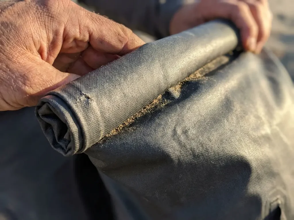 Close macro of the roll-top fabric and weave on a Black Diamond Beta Light 45 ultralight pack