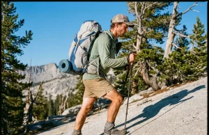 Best Ultralight Backpacks Really Under 2 Pounds Hiker on a granite trail wearing an Osprey Exos Pro 55 ultralight backpack at golden hour
