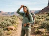 Sweaty Truth About Bamboo Fabric for Hiking Hiker adjusting bamboo fabric sun hoodie on a sunlit desert trail