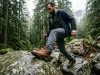 7 Men’s Leather Hiking Boots Tested One Clear Winner Man in full-grain leather hiking boots navigating rocky trail in Pacific Northwest forest