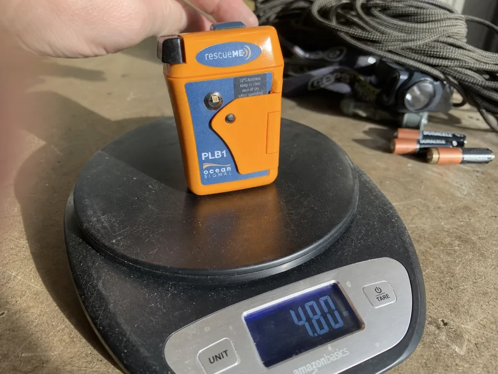 Compact Ocean Signal rescueME PLB1 beacon on a small scale showing its light weight
