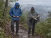Rain Jacket vs Poncho for Hiking Pick by Trip Hiker in a rain jacket beside a hiker in a poncho on a wet Appalachian Trail ridgeline