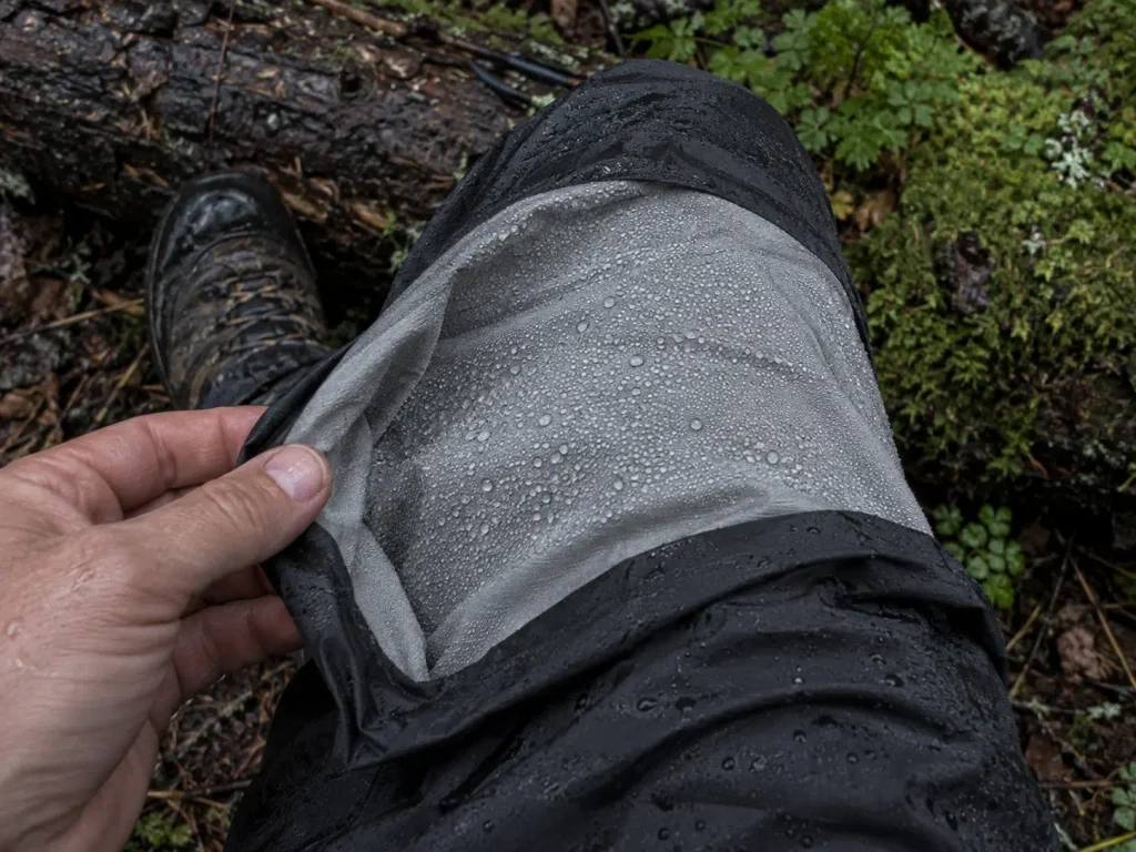 Close view of condensation beading on the inside of a hiking rain pant leg
